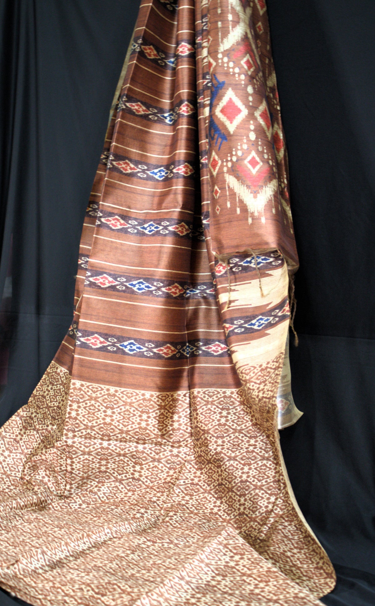 Earthy Brown Tussar Saree with Geometric Ikat-Inspired Motifs
