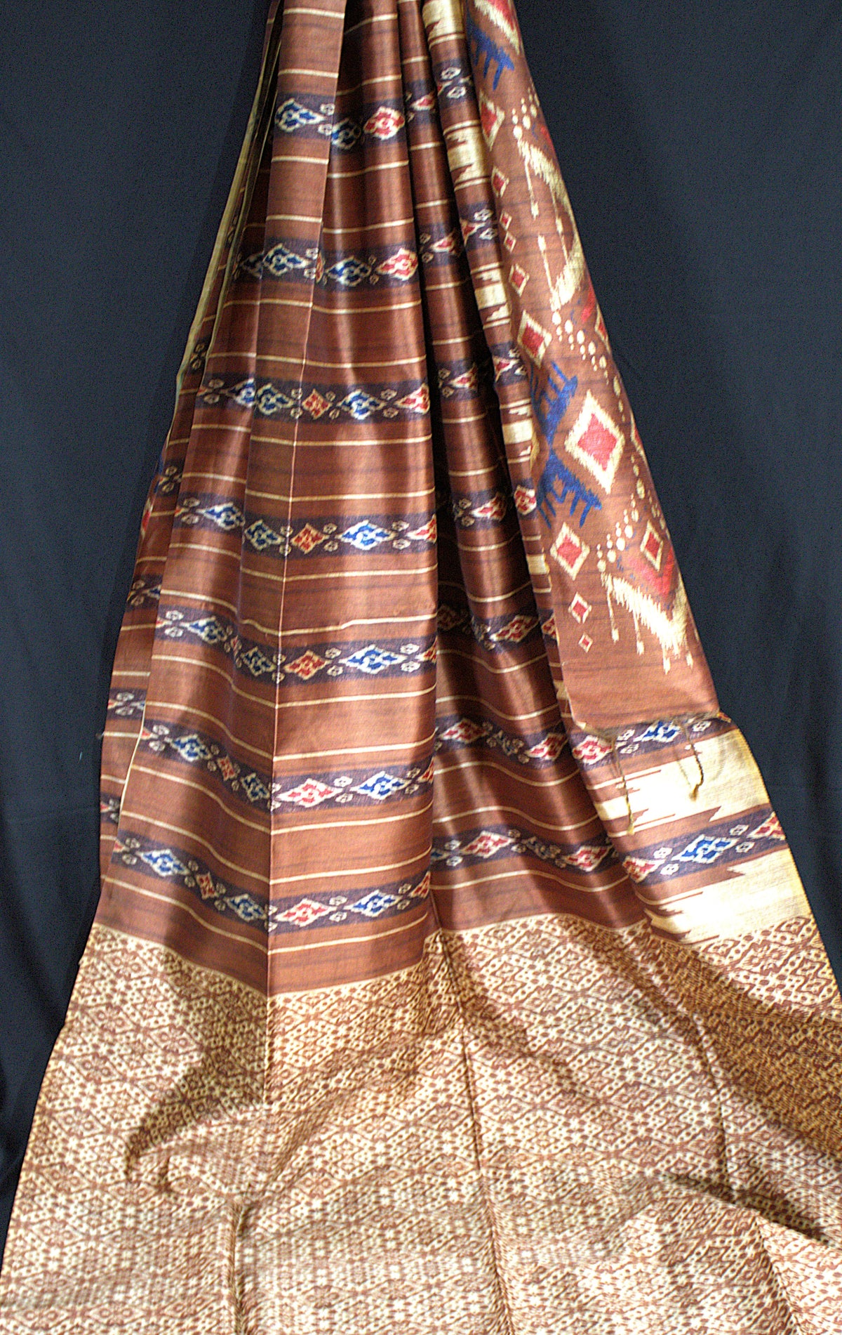 Earthy Brown Tussar Saree with Geometric Ikat-Inspired Motifs