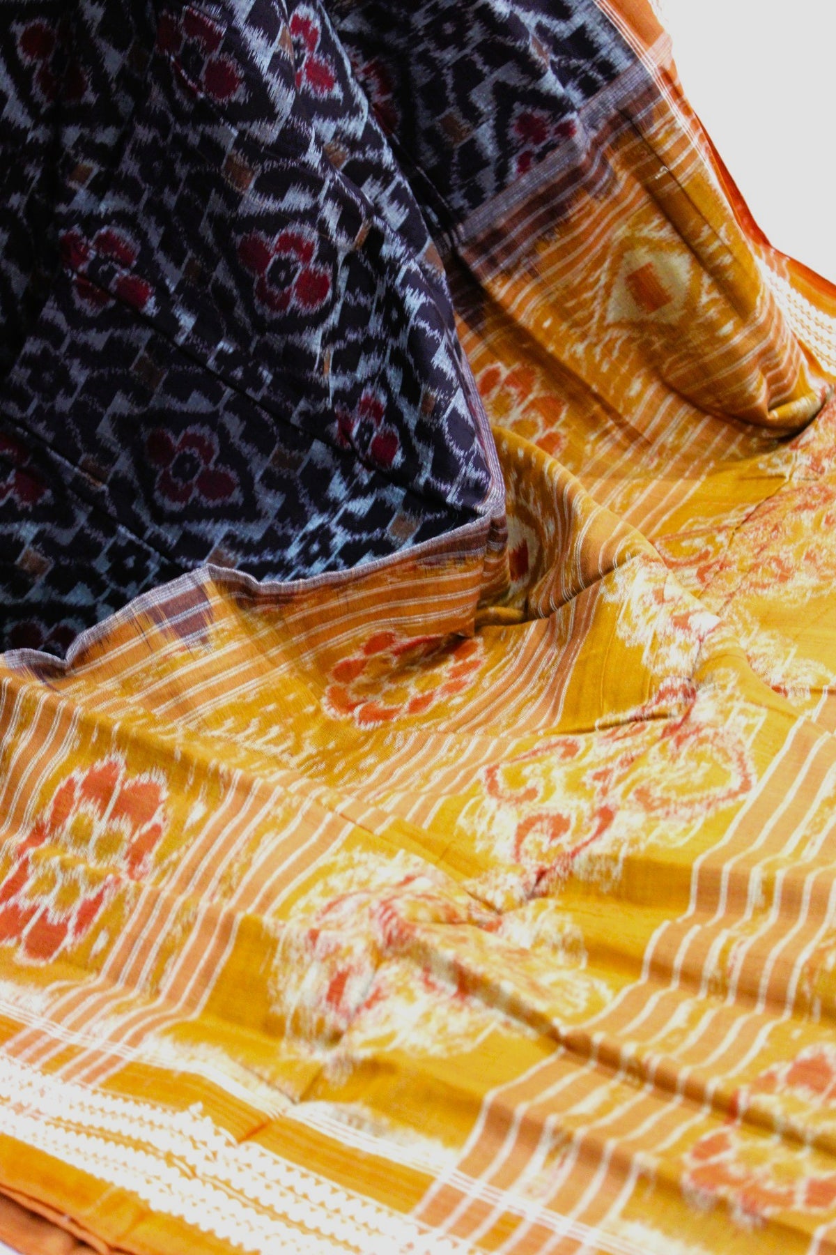 Black & Mustard Orange Floral Bandha Saree